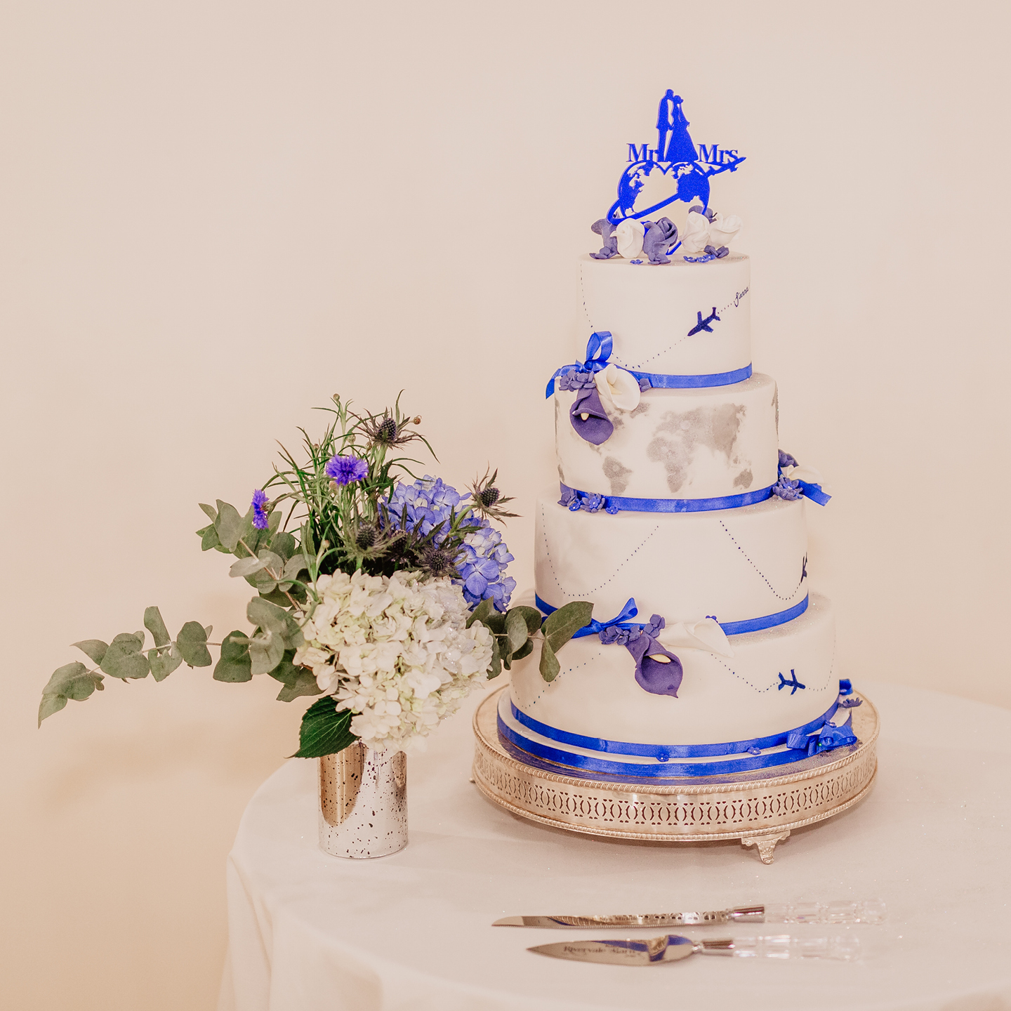 blue travel themed wedding cake